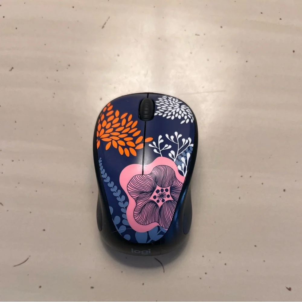 Logi wireless computer mouse with USB attachment